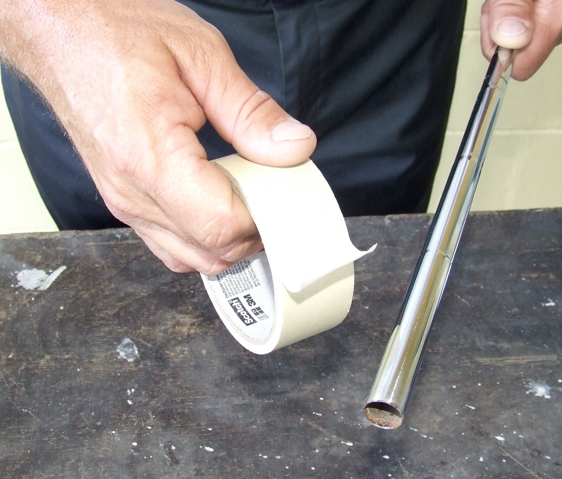 Add extra masking tape to the putter shaft